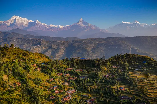 Snow-draped Annapurna and Machhapuchhre peaks above Barang Village