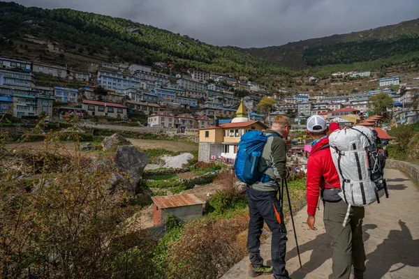 Trekkers overlooking the horseshoe-shaped Namche Bazaar village