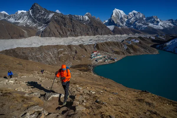 A climber ascends the ridge with the Ngozumpa Glacier sprawling below