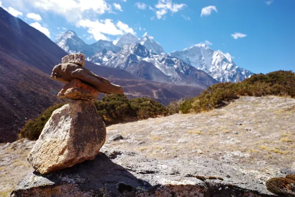 A stone cairn overlooking Taboche and Cholatse