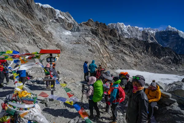 Trekkers gathering at the 5,420 m prayer flag summit