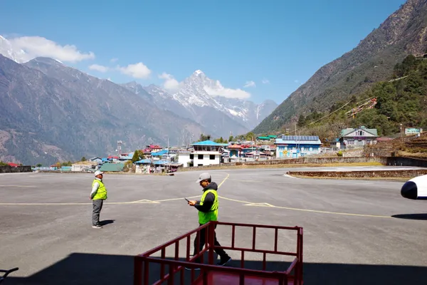Trekkers prepare for the flight from Lukla back to Ramechhap