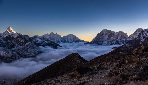 Ama Dablam and neighboring peaks rising above a sea of clouds near Kala Patthar