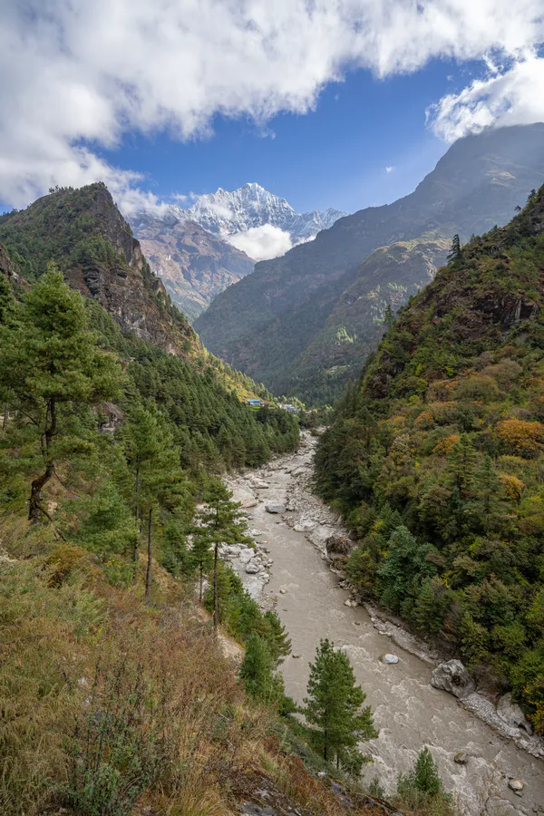 The Dudh Koshi River flowing through the Everest region with Kusum Kanguru ahead