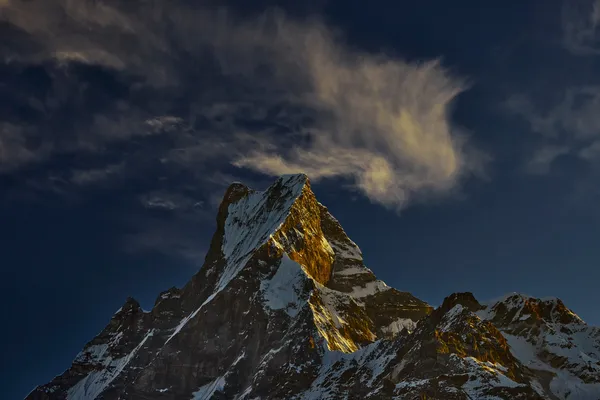 The Fishtail peak glowing under the last rays of afternoon sunlight