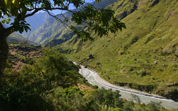The river winding through a deep green valley seen from high on the trail
