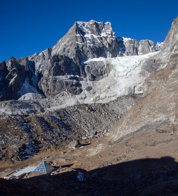 The glass pyramid research station beneath towering Khumbu summits