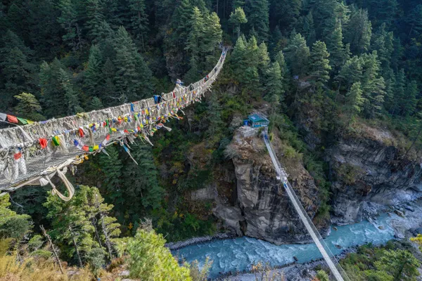 The two Larja bridges suspended between steep canyon walls
