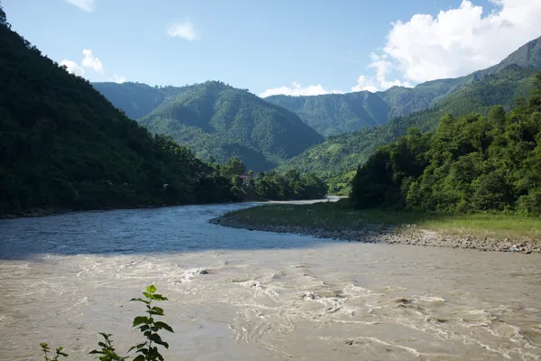 The Marsyangdi River winding through green hills