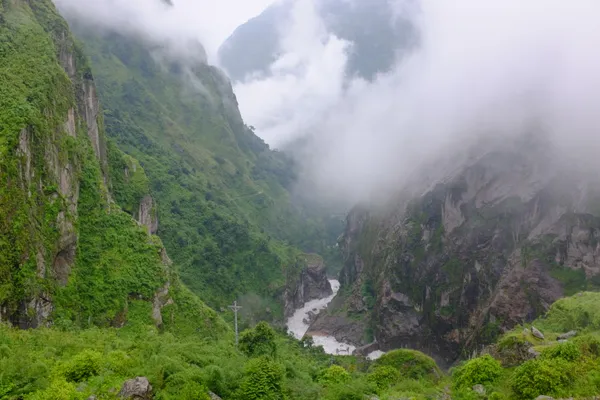 Clouds sweeping through a dramatic gorge