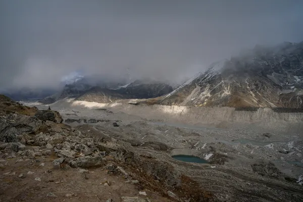 The vast rock-covered Khumbu Glacier sprawling below the trail from Gorak Shep