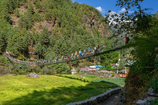 A swaying suspension bridge over the Dudh Koshi River