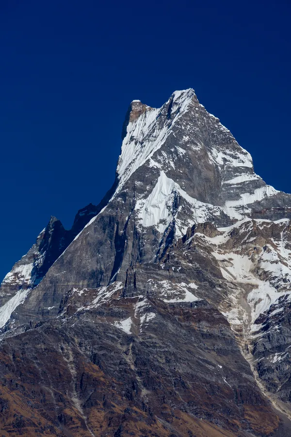 Close-up of Machapuchare's twin summit against a blue sky