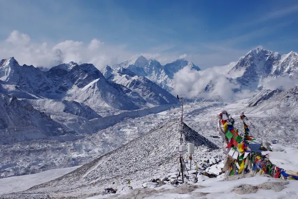 Colorful prayer flags fluttering above the Khumbu Glacier near Gorak Shep