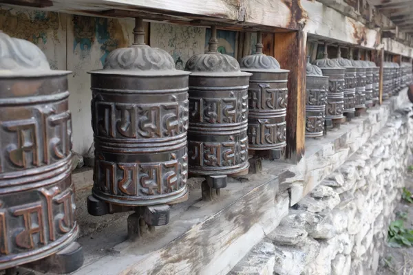 Bronze prayer wheels in Manang