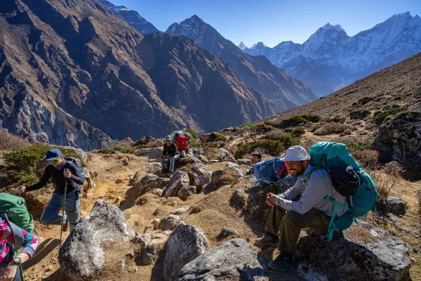 Hikers rest with panoramic views of Ama Dablam