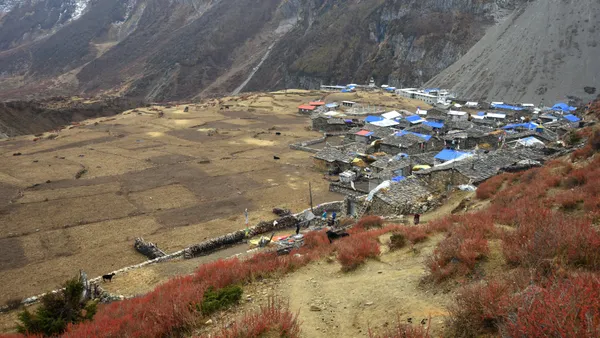 The remote stone houses and wind-swept fields of Samdo village seen from above