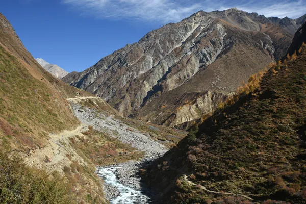 Sunlight blazing across snow-capped summits