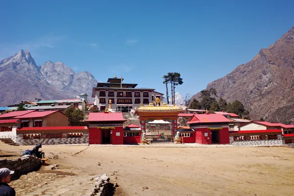 The colorful entrance to Tengboche Monastery against rugged peaks