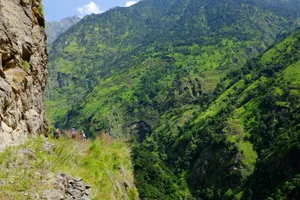 Trekkers on a narrow mountain trail