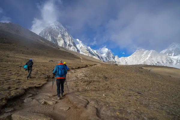 Trekkers climbing the final ridge from Gorak Shep to Kala Patthar