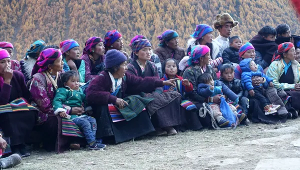 Local residents in vibrant traditional clothing