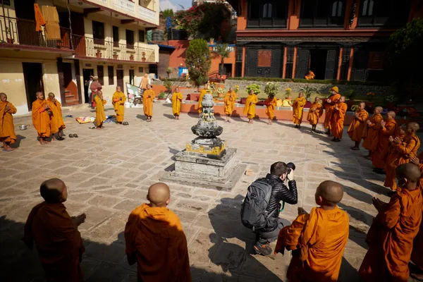Young Buddhist monks walking through the streets of Kathmandu